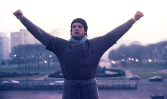 This is the famous film still of Rocky raising his arms triumphantly into the air.